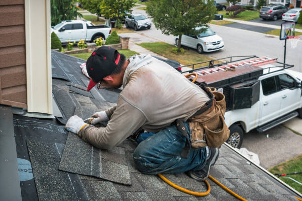 Professional Roofing technician working in Pembroke, MA